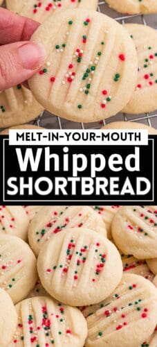 Close-up of a round whipped shortbread cookie topped with red, green, and white round sprinkles. The cookie has fork marks and is being held above a cooling rack with more cookies in the background. Text reads: Melt-in-your-Mouth Whipped Shortbread.